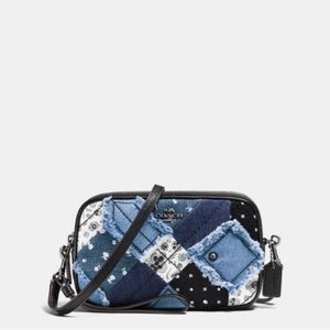 Coach crossbody clutch in canyon quilt Denim in Blue. Gently used